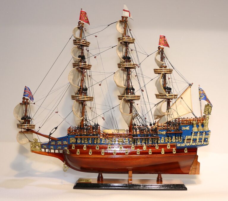 A handcrafted model of the SOVEREIGN OF THE SEAS ship displayed on a wooden base.