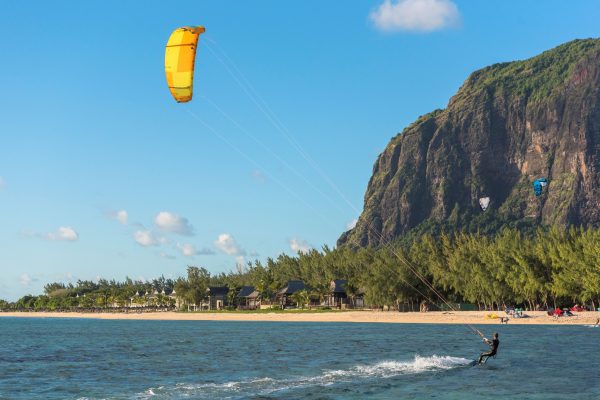 Guests kite surfing at Le Morne Peninsula near JW Marriott Mauritius Resort.