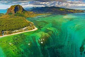 Aerial view of the Mauritius Underwater Waterfall Illusion near Le Morne Brabant, showcasing sand and silt movement.