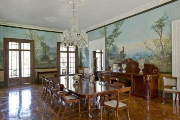 Interior of Château de Labourdonnais showcasing colonial-era furniture and decor