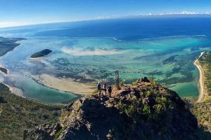 Hiker on Le Morne Brabant trail with ocean views