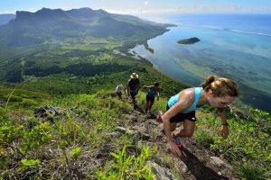 Hiker on a trail in Black River Gorges