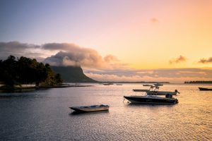 Vibrant sunset over the waters of Le Morne Beach