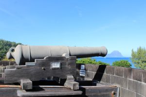 Stone fortress tower overlooking the ocean.