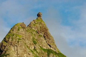 Iconic peak with a boulder at its summit
