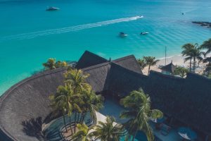 Aerial view of Royal Palm Beachcomber Luxury with its beachfront, tropical gardens, and crystal-clear lagoon.