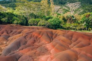 Vibrant layers of colored sand in Chamarel