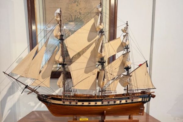 A beautifully displayed ship model in a luxury Mauritian resort lobby.