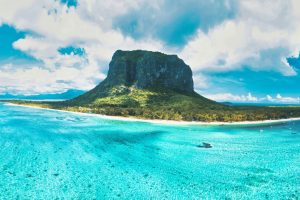 A panoramic view of Le Morne Brabant with lush greenery and dramatic cliffs.