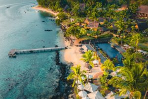 Aerial view of The Oberoi Beach Resort Mauritius, with tropical gardens and oceanfront villas.